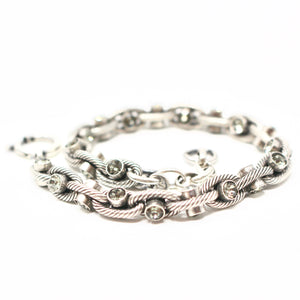 Beautiful chain link bracelet with delicate crystal inserts. Great as a statement piece or holiday gift!