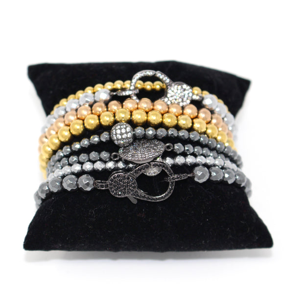 stackable bead bracelets in gold, copper, silver, and pewter