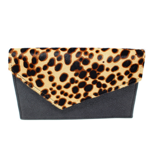 This gorgeous bag features genuine black leather paired with a calf hair leopard print